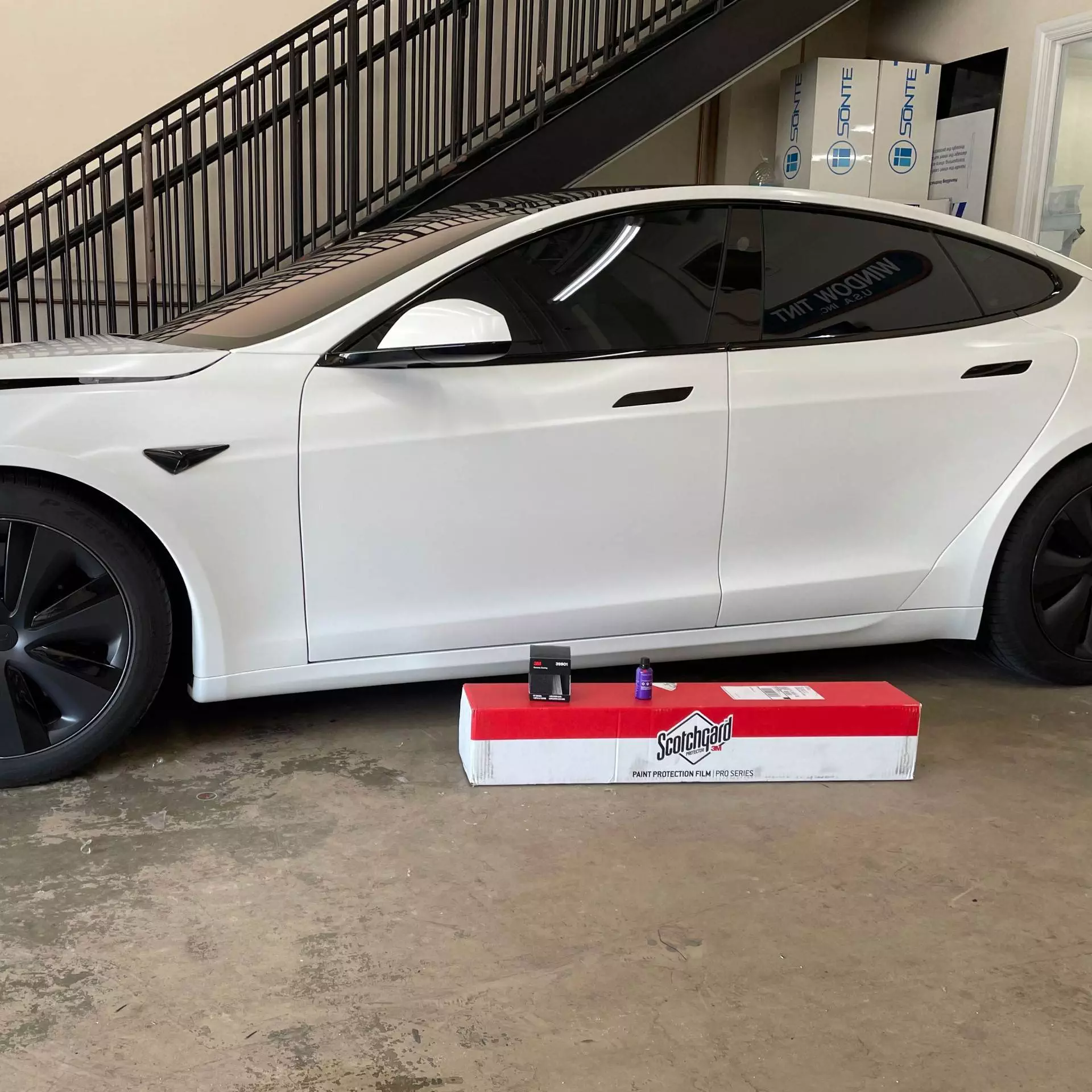 Tesla Model S with matte white paint protection film
