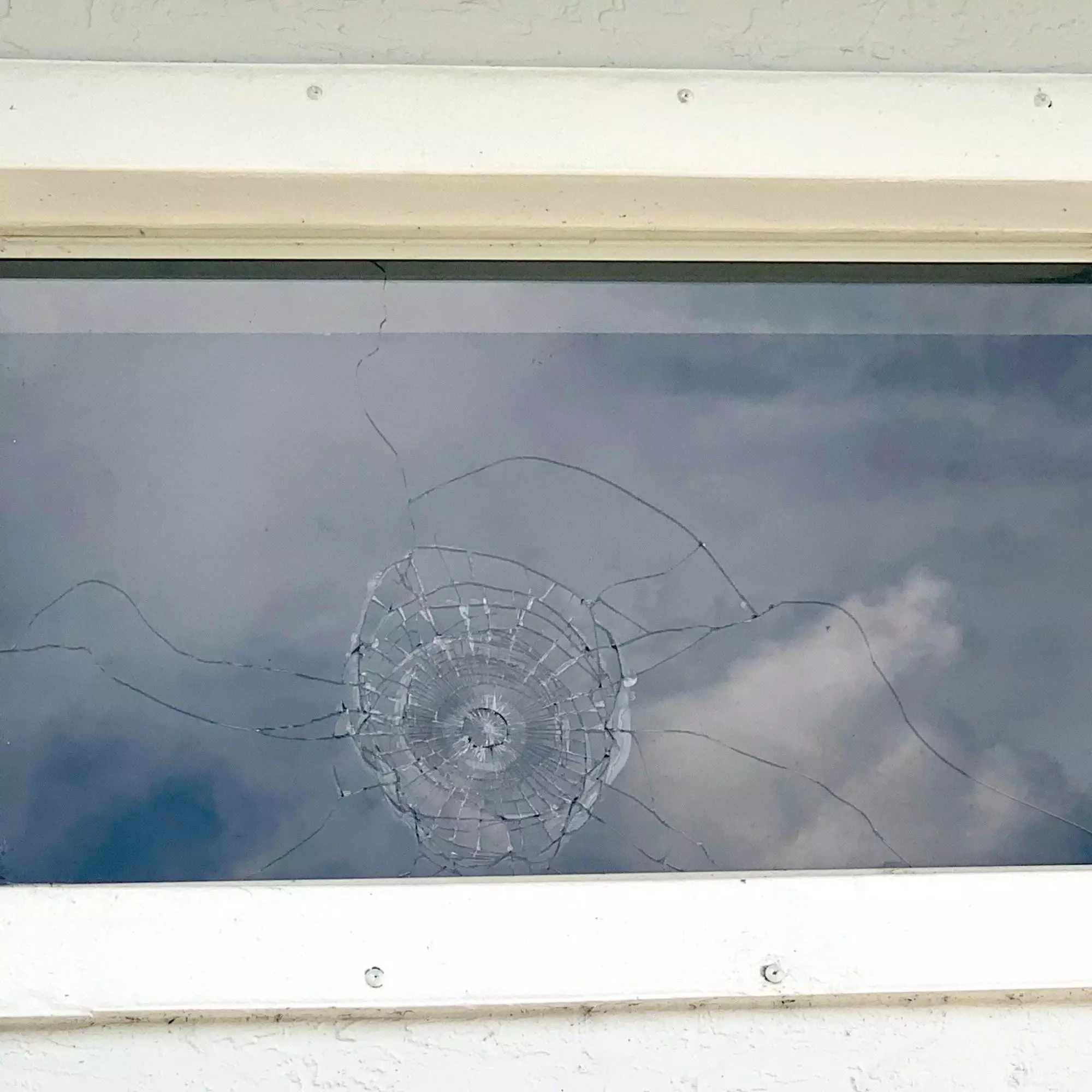 Security window film stops golf ball