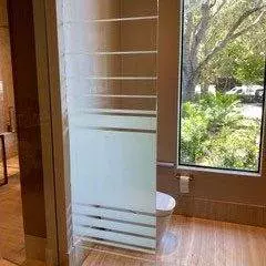 Before: Clear glass panel offers no privacy